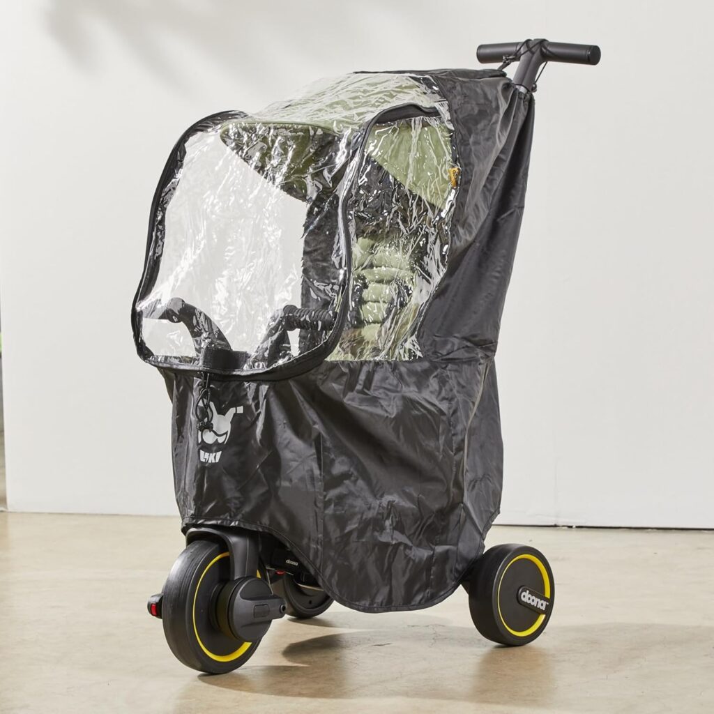 Doona Liki Trike stumjamā riteņa lietus plēve